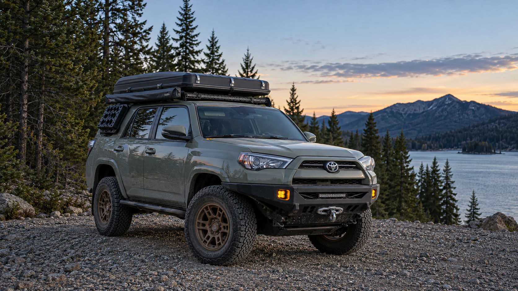 An overland-equipped Toyota 4Runner at a mountain campsite.